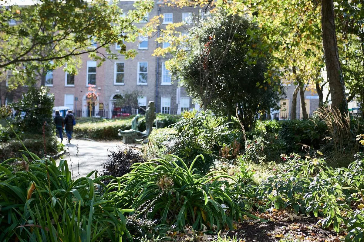 Georgian houses standing behind the gardens of Merrion Square in Dublin