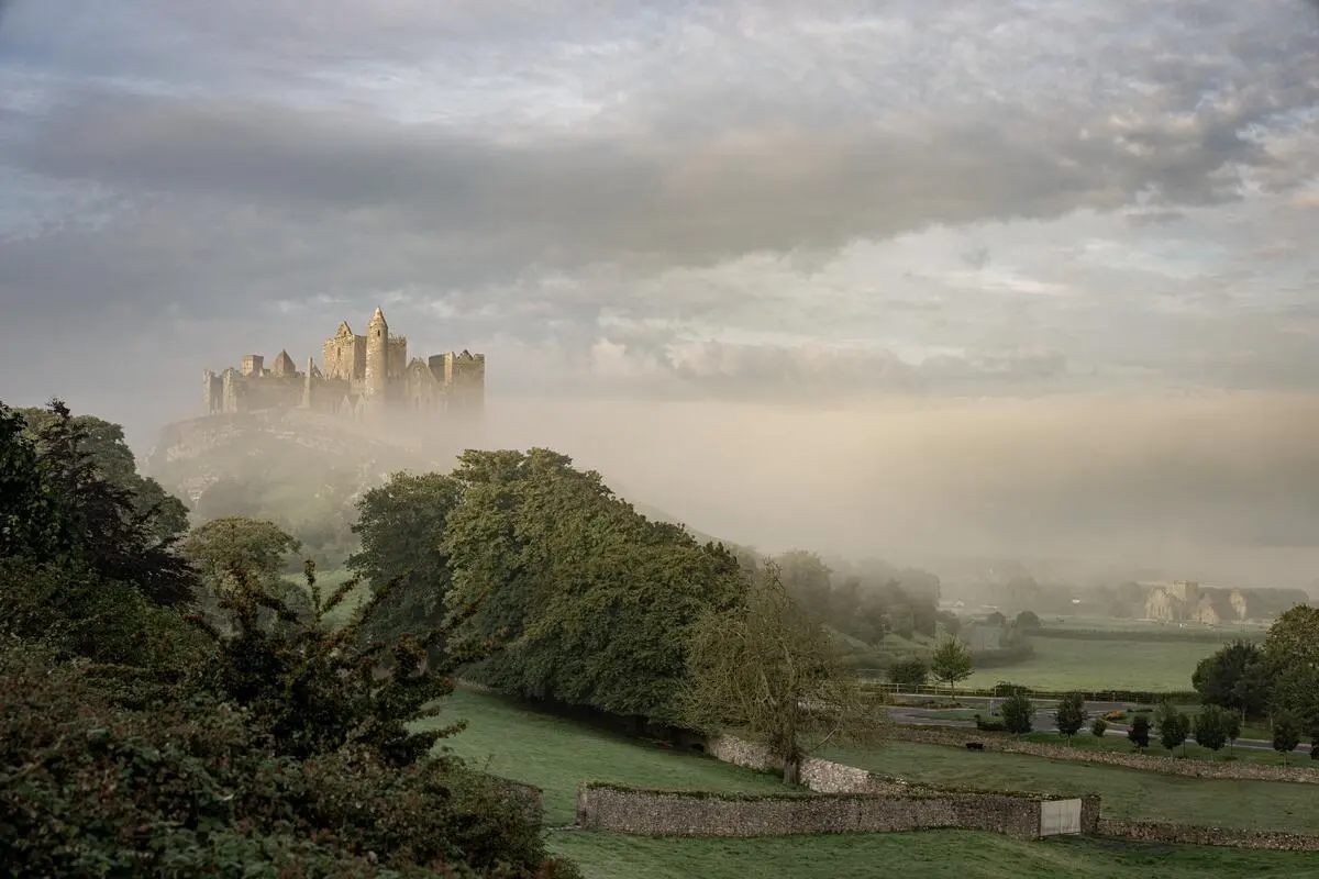 The Rock of Cashel standing above mist on the Tipperary plain